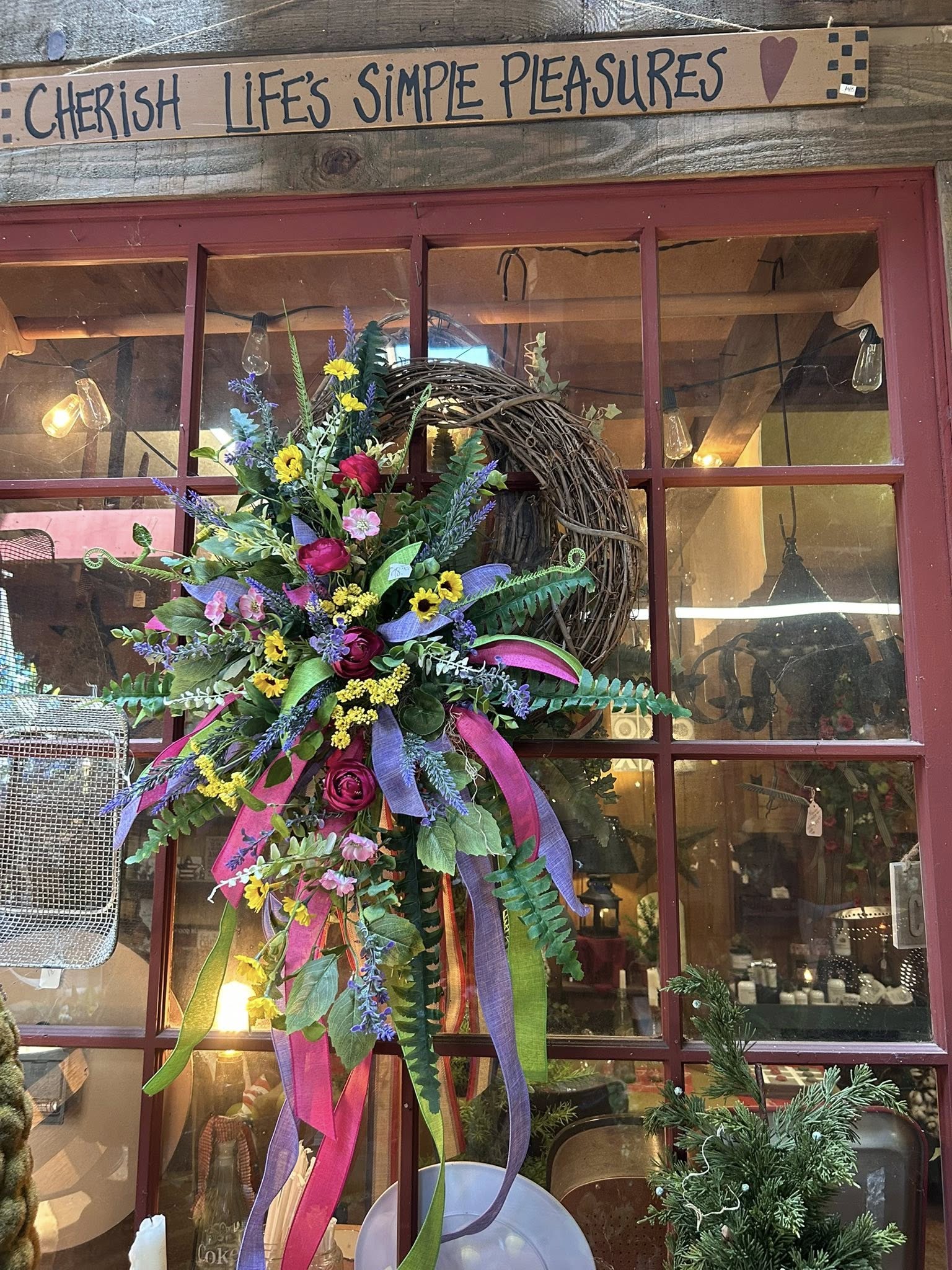 Colorful spring wildflower swag wreath with Cherish Life's Simple Pleasures sign