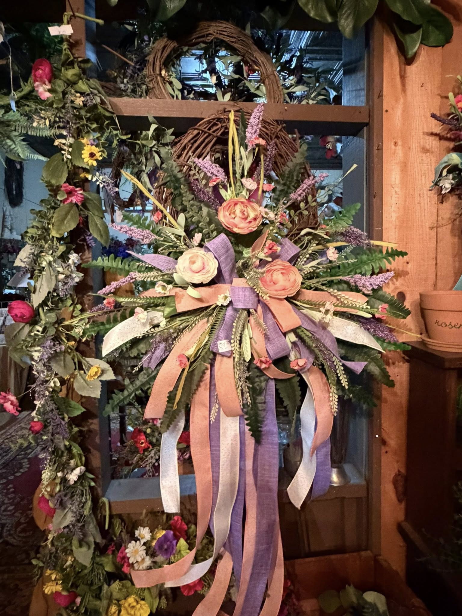 Pink and lavender spring swag wreath with peach ribbon trails